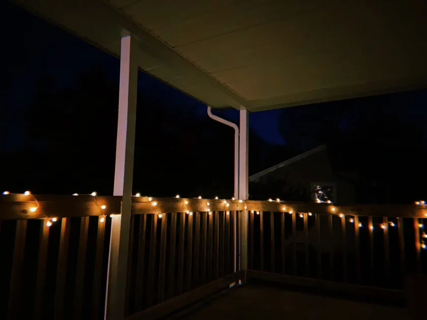 Warm Balcony Dark Night Wooden Railings Angle View String Lights