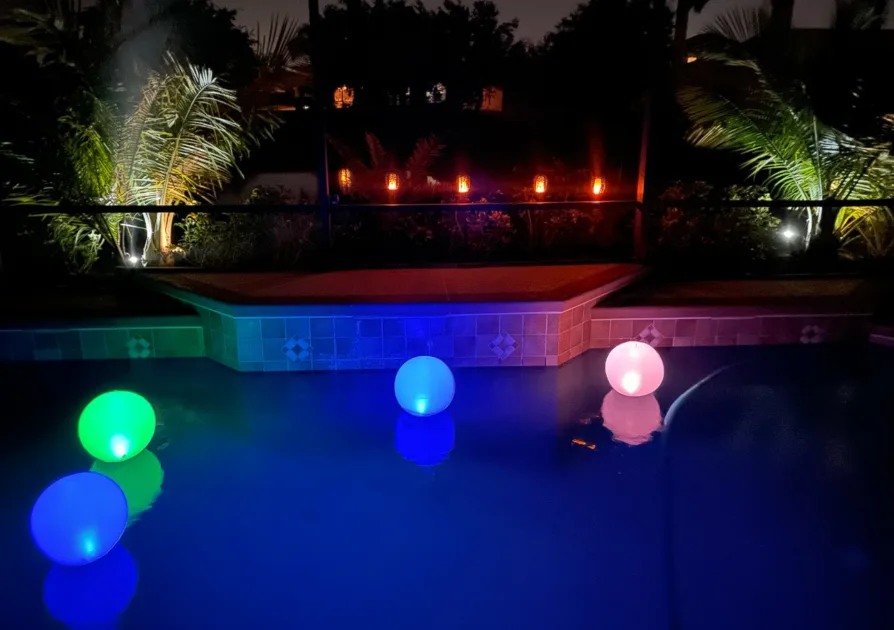 Poolside Party Lights Floating Balls And Dim Lanterns On Railings
