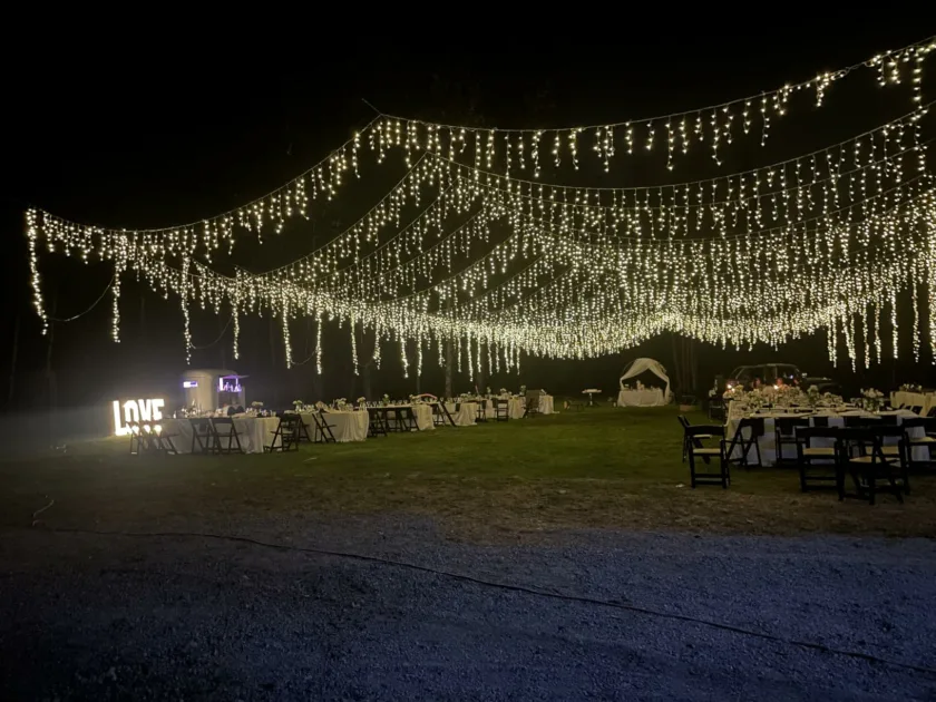 Warm Stringlights Love White Tablecloth Grass Bottom Side Angle View Outdoor Lights For Wedding